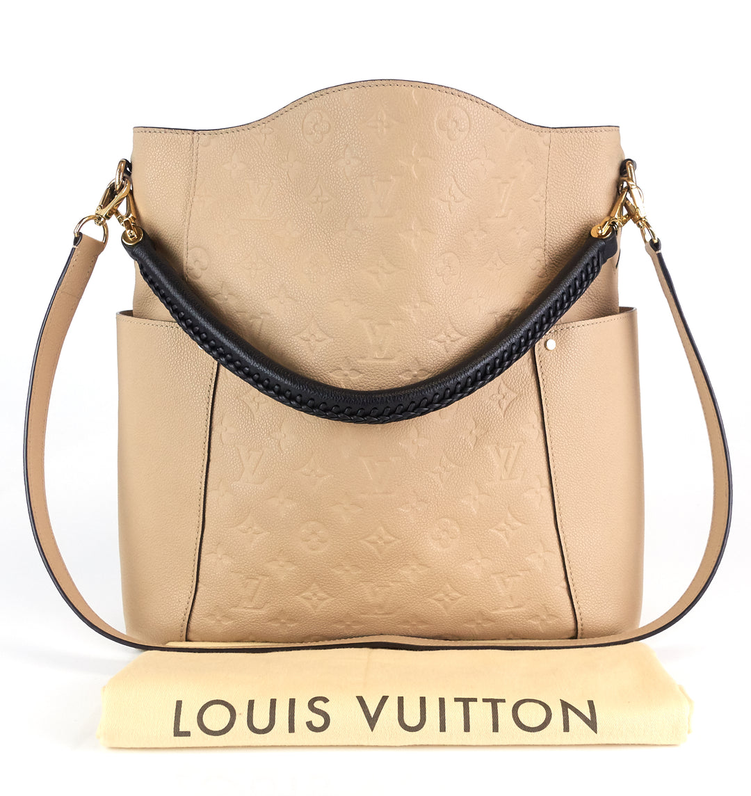 All about the neutrals! Shop this beautiful Louis Vuitton Empreinte Bagatelle  Hobo bag on www.mymoshposh.com!